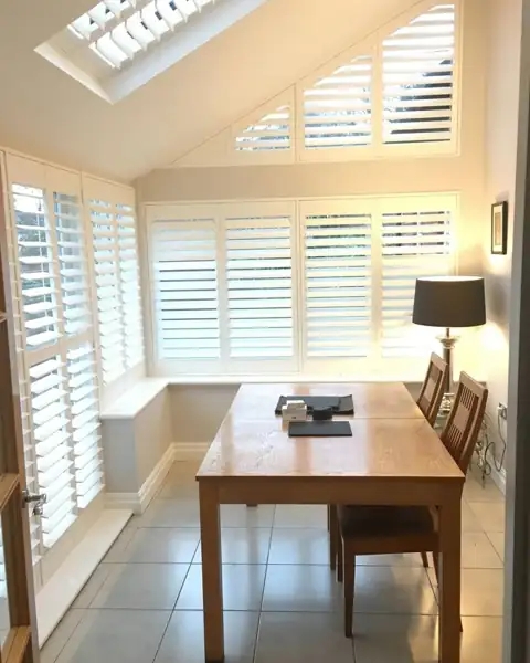 Hardwood shutters in a conservatory